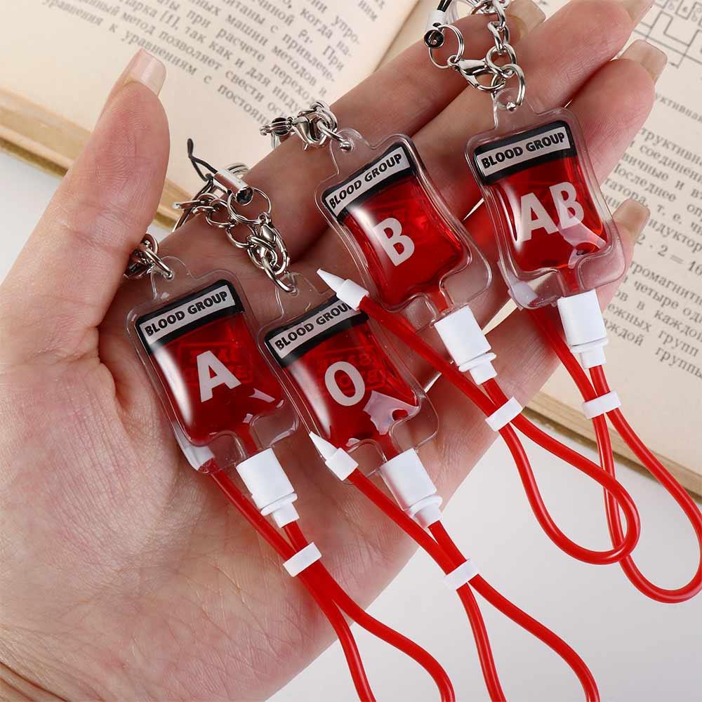 سلسلة مفاتيح على شكل كيس دم بل - مراجعة Phone Accessories Unique وسعره