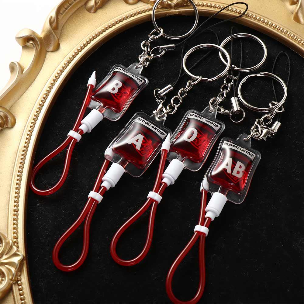 ميدالية مفاتيح على شكل كيس دم  - مراجعة Phone Accessories Unique وسعره